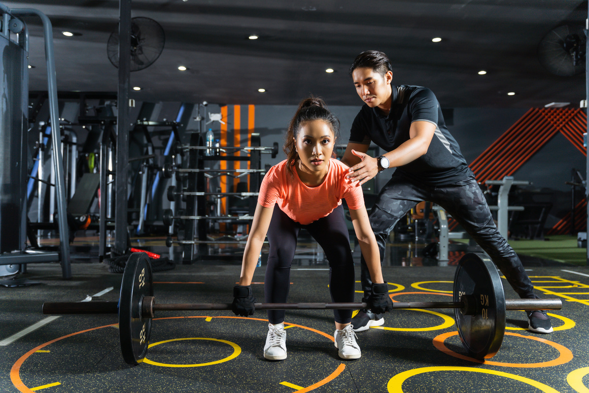 Personal trainer teaches about exercise deadlift posture